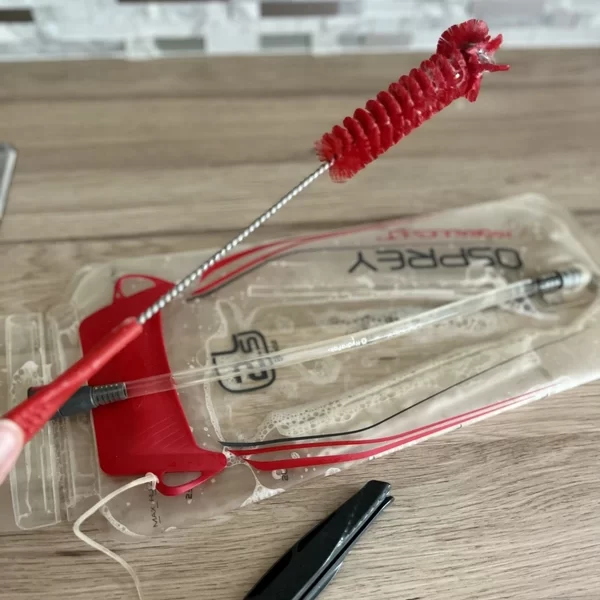 clean the reservoir with the larger brush and a little dishwashing soap - How To Clean A Hydration Bladder