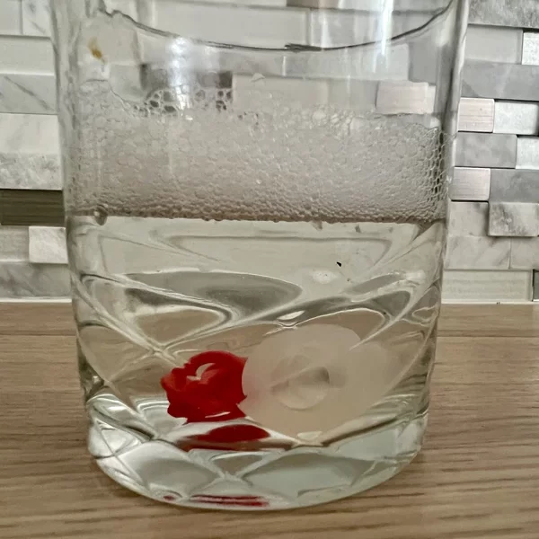 soak the bite valve in a soapy glass of hot water - How To Clean A Hydration Bladder
