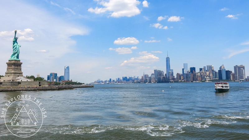 the statue of liberty and the Manhattan skyline
