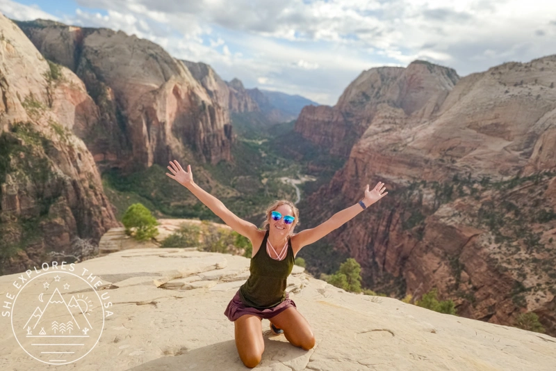 view from the angels landing summit with the author pictured in the center