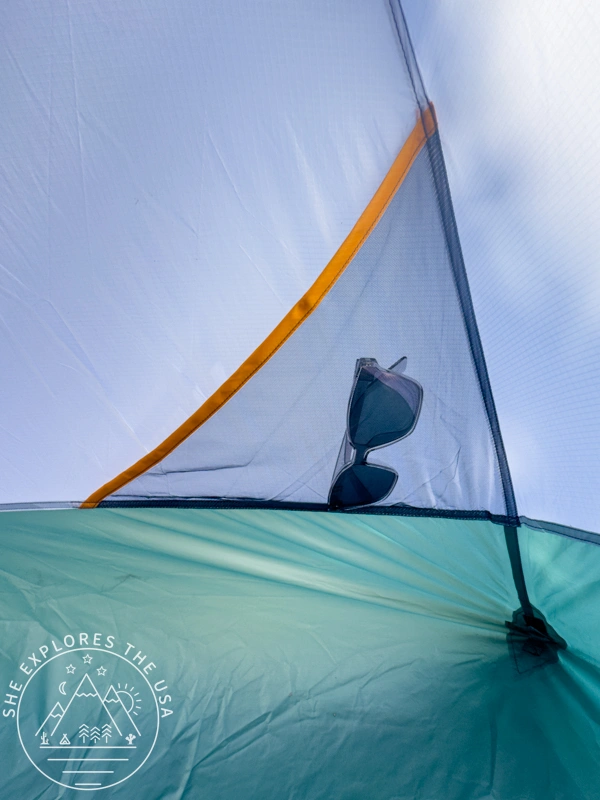 2 Large Pockets: On the short sides of the tent (ideal for the head-to-toe sleeping configuration).