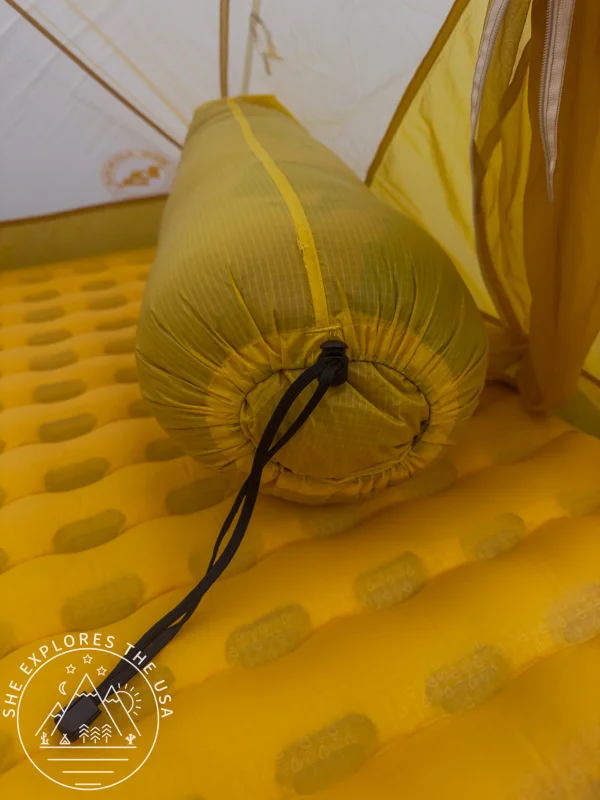 Feathered Friends Petrel UL 10 sleeping bag in its stuff bag showing the tie