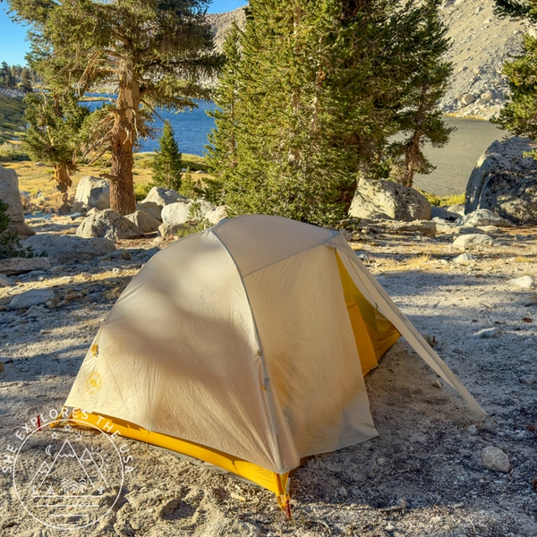 Big Agnes tent pitched in the backcountry near an alpine lake after being treated with Nikwax