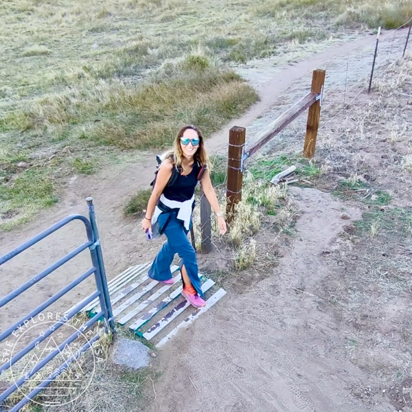 ariel view of a woman hiking using the HoverAir X1 Pro in spiral mode
