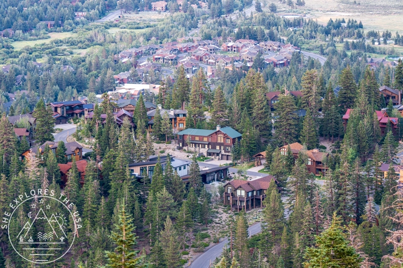 Aerial view of mountain houses and pine trees in Mammoth Lakes California taken from Panorama Dome - where to stay in Mammoth Lakes